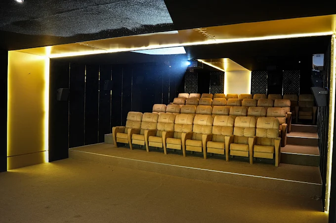 Private theatre with gold reclining seats